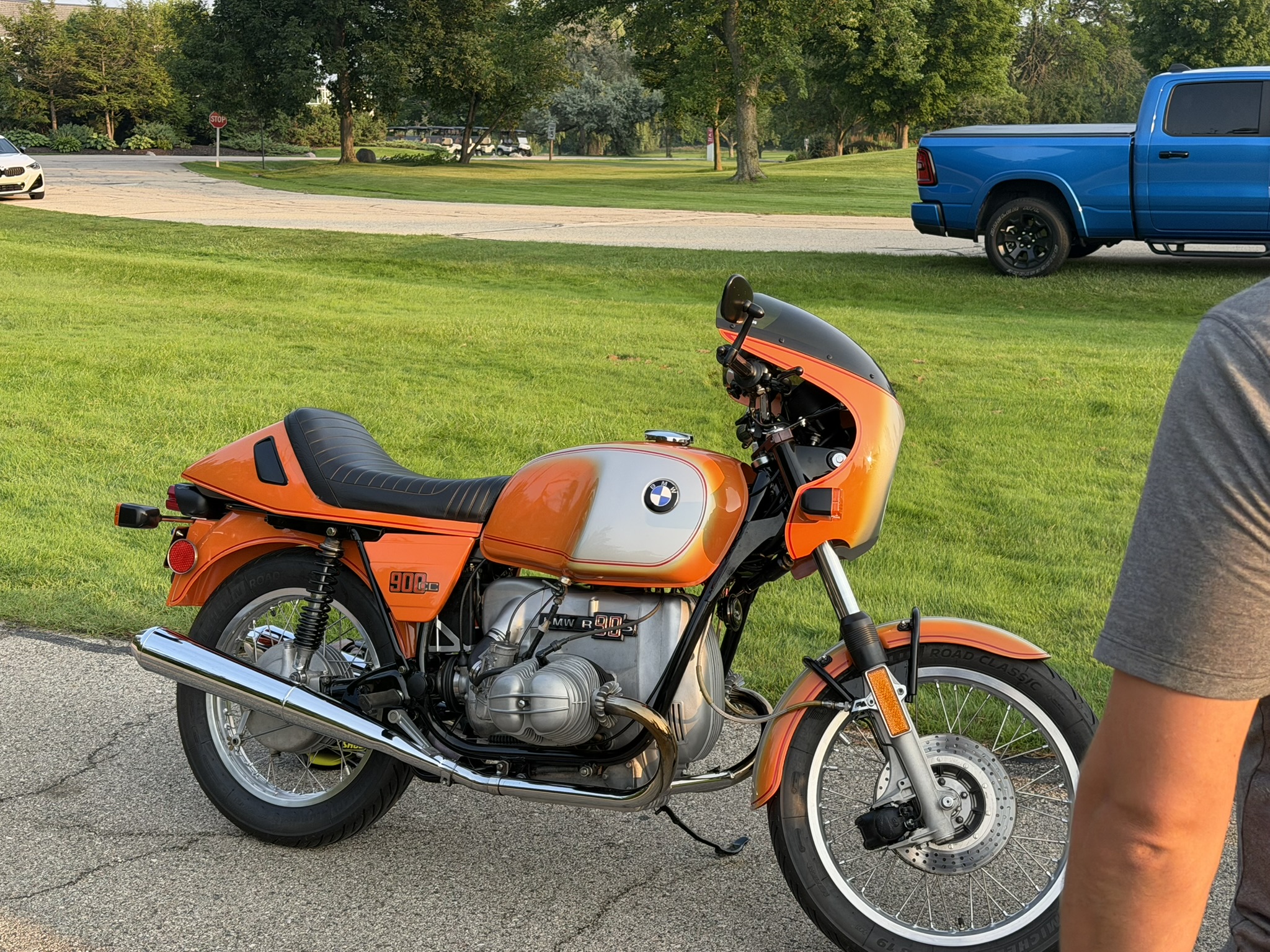 Classic BMW R90S motorcycle displayed among the cars at BMW and MINI Night